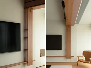 Minimalist living room with wood, steel, and concrete elements, showcasing sleek, functional design.