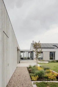Modern house with wood siding and concrete patio