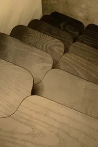 Modern, minimalist wooden stairs, likely made of oak or another hardwood.
