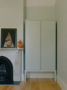 Modern cabinet and fireplace in a living room setting.