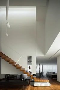 Modern interior with wooden staircase and concrete living room