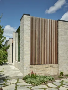 Modern architecture featuring brick and wooden elements.