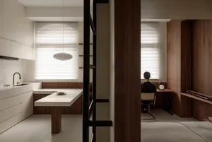 Modern kitchen featuring minimalist design, white cabinets, and wooden accents.