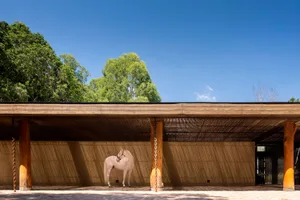 A minimalist stable with wooden elements.