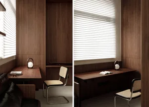 Minimalist home office with wooden desk, chair, and wall paneling.