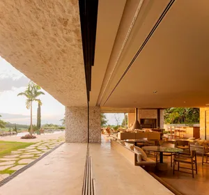 Modern residential interior featuring a concrete floor and walls.