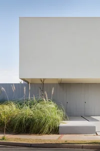Minimalist modern exterior featuring clean lines and a concrete façade.