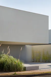 A modern minimalist building with a concrete facade.