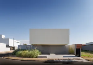 A minimalist, modern building with a concrete exterior.