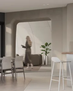 Modern living room with concrete ceiling and floor, featuring comfortable seating arrangements and large windows with a city 