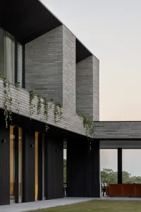 Modern residential exterior featuring brick-clay material.