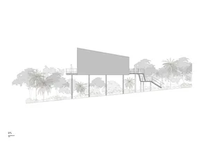 Minimalist building with metallic cladding and elevated walkway