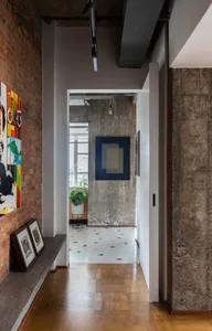 An industrial design interior featuring concrete walls and floor tiles in a minimalist setting.