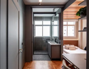 A modern, minimalist bedroom featuring industrial elements and a contemporary design.