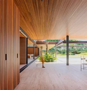 A modern architectural interior featuring a wooden structure and floor.