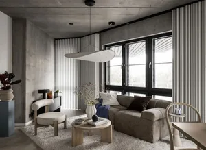 A modern living room with a concrete ceiling, large windows with vertical blinds, and minimalist furniture.