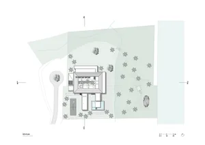 A modern site plan with a building, trees, and pathways