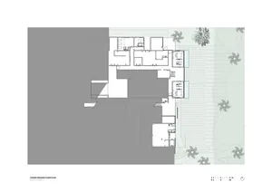 Floor plan detailing the layout of a residential building's ground level, including rooms and spaces.