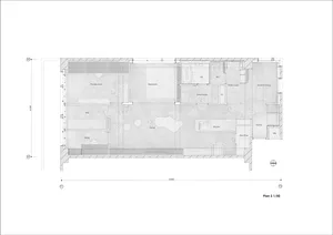 Floor plan of a modern living space with grey concrete walls and a central living area.