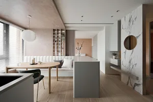 A modern interior design featuring a neutral-toned marble kitchen and living room intersection with white painted walls, mixe