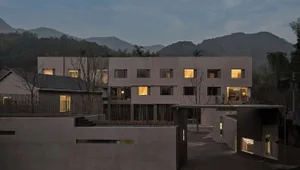 A minimalist, modern residential building constructed with concrete.