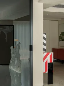 Modern minimalist office space with concrete walls and floor.
