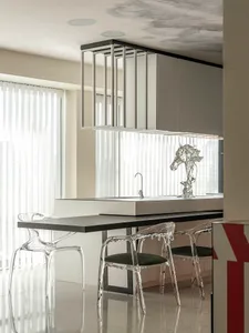 Modern kitchen featuring polished concrete surfaces and minimalist design.