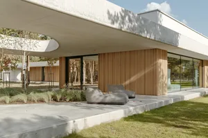 Modern architectural design featuring concrete and wooden elements.