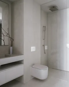 Minimalist modern bathroom with concrete walls and floor.