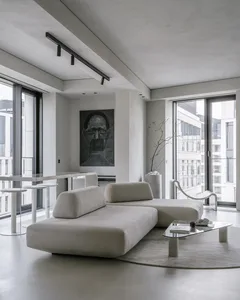 Modern living room featuring a textured concrete floor and contemporary furniture.