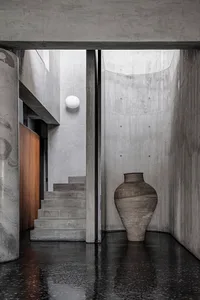 Modern home interior featuring polished concrete floors and minimalist design elements.