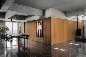A minimalist interior design featuring wood elements in a modern setting.
