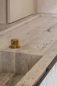 Close-up of a minimalist concrete bathroom countertop