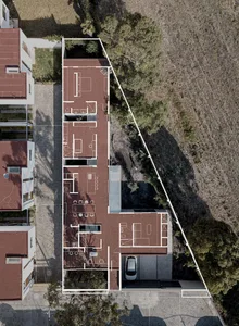 Aerial view of a modern house layout with a brick tiled exterior.