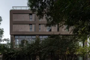 Modern building exterior with concrete facade and large windows