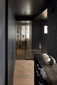 Modern interior design featuring wooden and concrete elements.