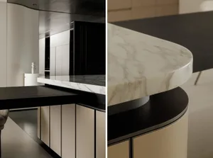Modern kitchen featuring marble countertops and black table with white chairs.