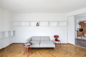 Modern living room with minimalist design featuring wooden furniture