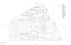 Floor plan of a modern residential space with glass and concrete materials