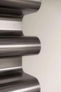Linear metal staircase with curved steps.