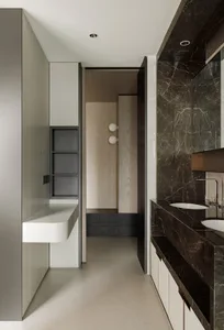 Modern bathroom interior featuring marble, concrete, and wooden elements.
