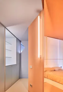 Modern minimalist bedroom with orange walls and white furniture, white floor