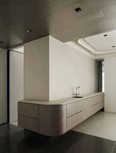 Modern residential interior with minimalist design featuring floating wood cabinets.