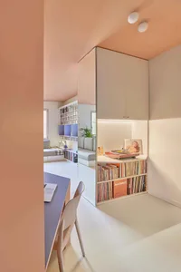 A minimalist music room features mirrored-paneled walls, creating a unique and elegant space.