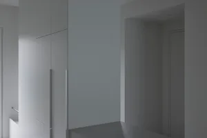 Modern minimalist interior with white materials and clean lines.