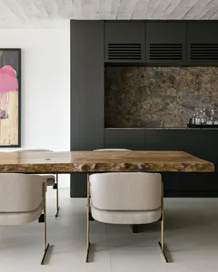 Modern dining room featuring a wooden table and metal chairs.