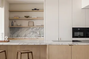Modern kitchen featuring marble countertop and minimalist design