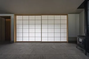 A modern interior featuring a large sliding glass door.