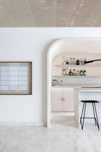 Modern interior with a bar counter made of marble.