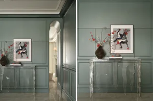 Modern entryway with a glass console table, green wall paneling, and abstract art.